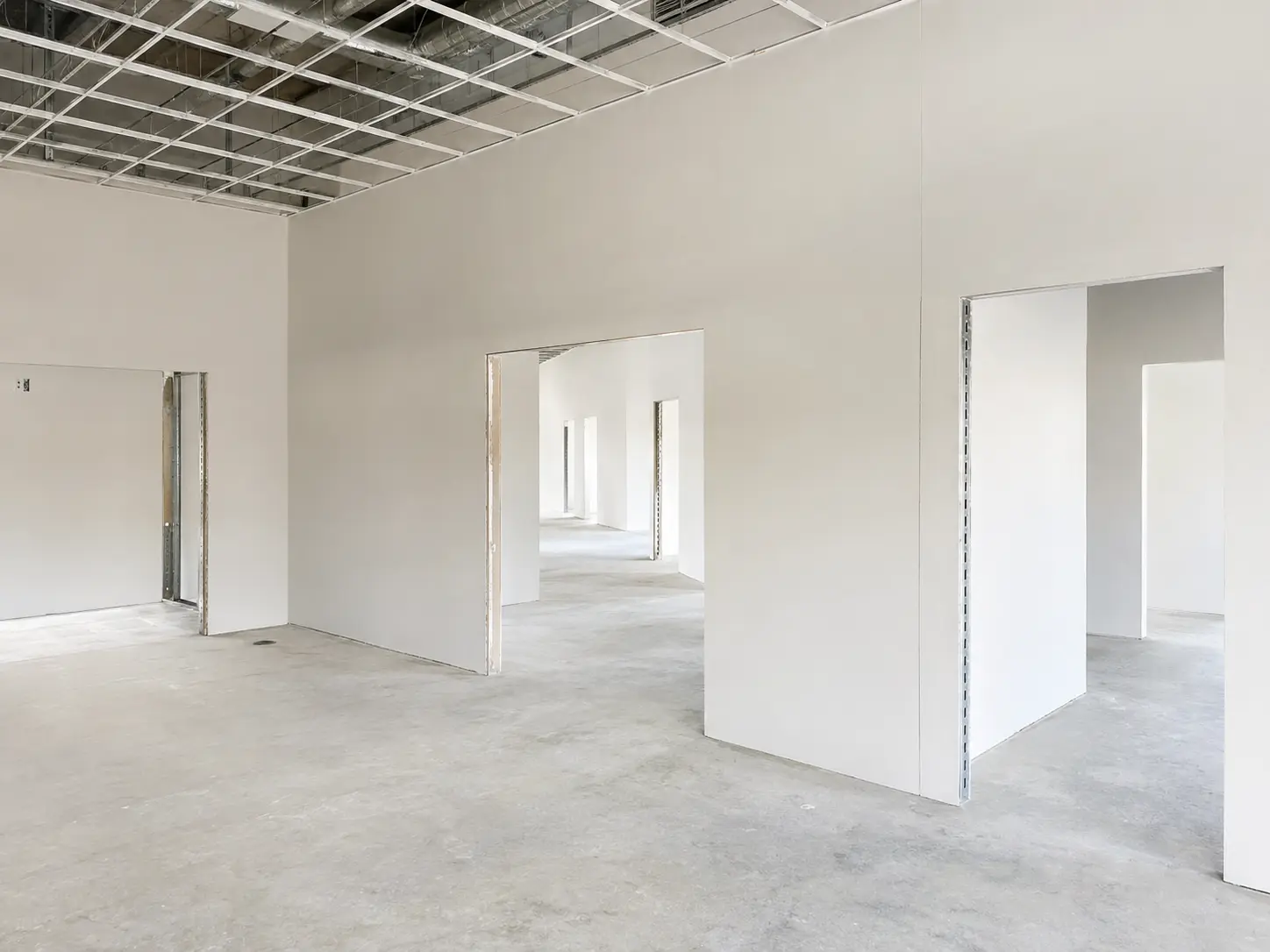 Freshly installed drywall in a commercial interior